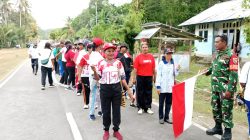 Babinsa Amankan Jalan Sehat HUT Ke-81 RI di Biak Timur